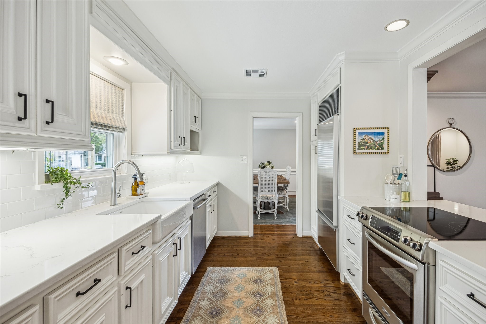 5655 Overbrook Lane Houston, TX 77056 - Photo 12 of 36 Pretty apron front farm sink and built-in Subzero refrigerator and freezer. Per the Seller, gas connections are available via the attic above for a gas range (to be independently verified by Buyer).