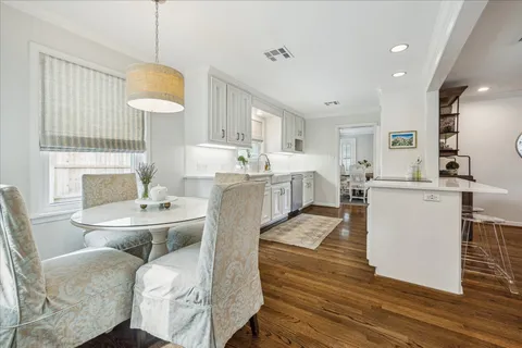 a kitchen with granite countertop a sink and a stove