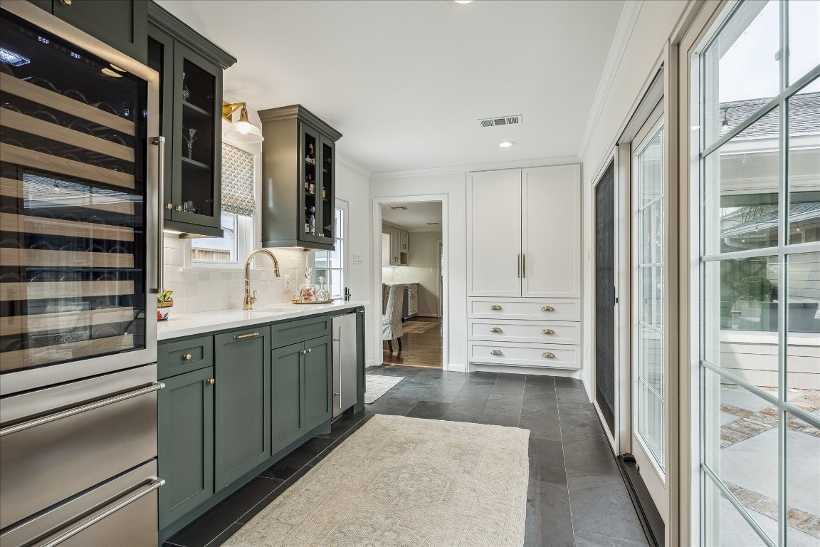 5655 Overbrook Lane Houston, TX 77056 - Photo 17 of 36 Added on by the current owner, this space adjoins the home to the 2-car garage, creating an attached garage and a beautiful focal point of the home perfect for those who love to entertain!