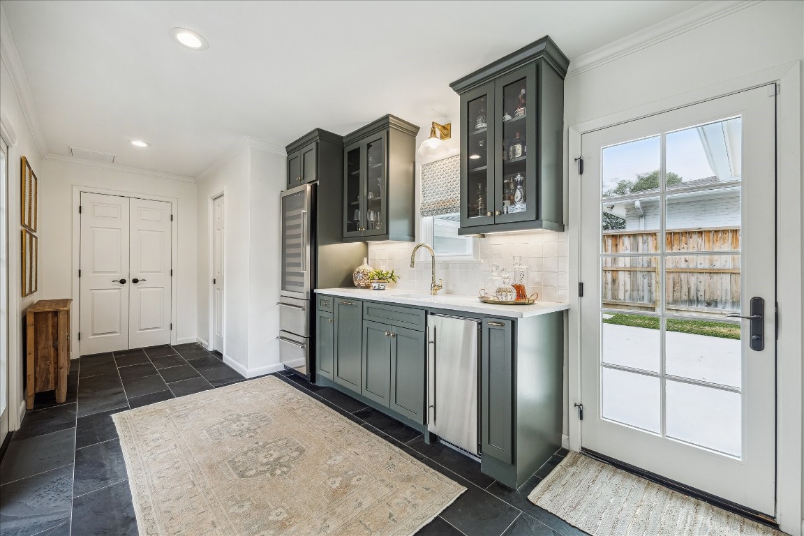 5655 Overbrook Lane Houston, TX 77056 - Photo 19 of 36 Custom Pella door leads to driveway. Straight ahead are the newly added half bath and utility room!