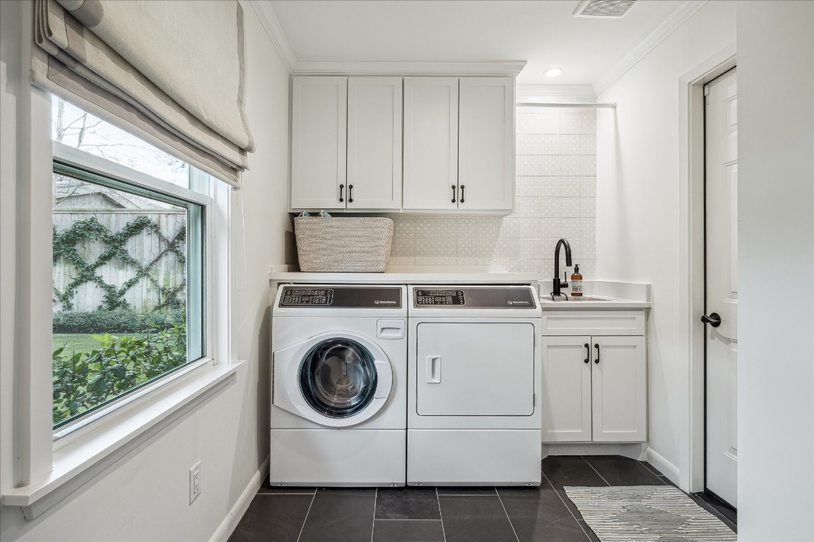 5655 Overbrook Lane Houston, TX 77056 - Photo 22 of 36 The fabulous utility room allows for a full size washer/dryer, and also has wonderful storage + an additional sink and drip dry area.