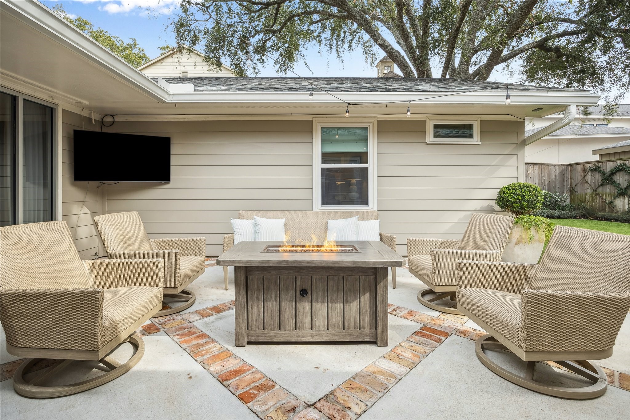 5655 Overbrook Lane Houston, TX 77056 - Photo 29 of 36 A 2021-2022 complete overhaul of the backyard, made by the current owner, included all new patio/hardscape, grill pad, yard lighting, gutters, mosquito system, privacy fence and Greenlinks artificial turf!