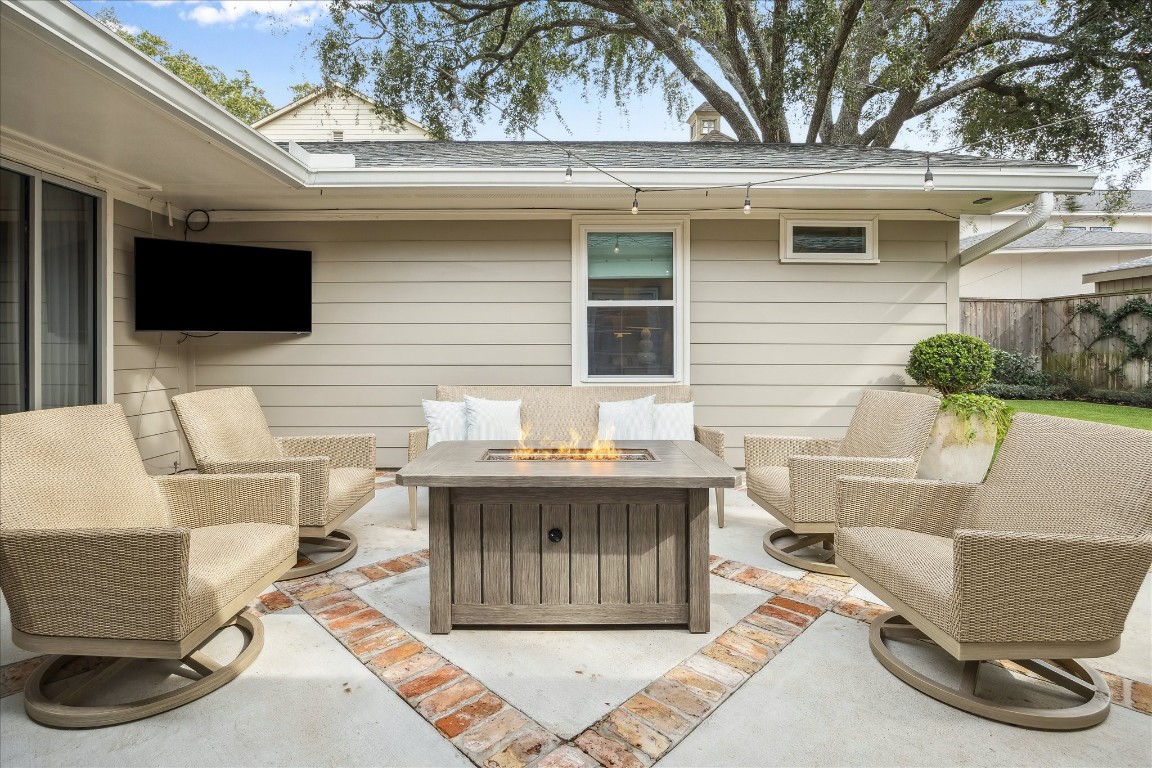 5655 Overbrook Lane Houston, TX 77056 - Photo 29 of 36 A 2021-2022 complete overhaul of the backyard, made by the current owner, included all new patio/hardscape, grill pad, yard lighting, gutters, mosquito system, privacy fence and Greenlinks artificial turf!