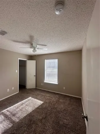 a view of a livingroom with a ceiling fan