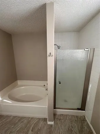 a bathroom with a granite countertop sink a toilet and mirror
