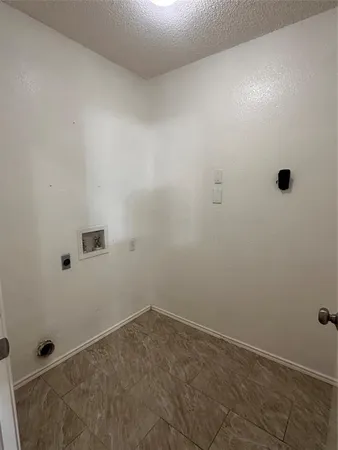 a view of a big room with closet and windows