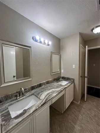a bathroom with a shower and a bath tub