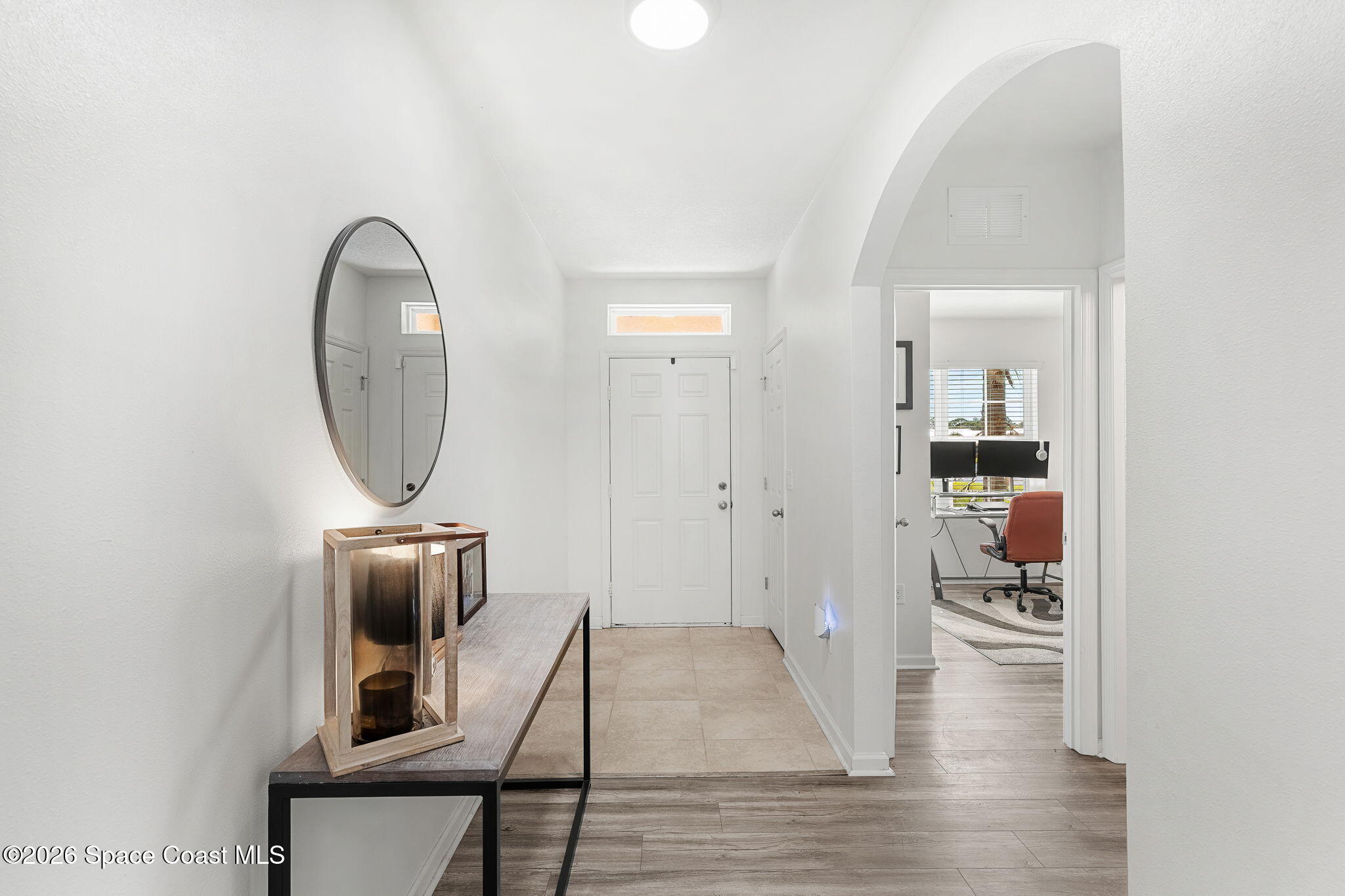 202 Alamere Drive Southwest Palm Bay, FL 32908 - Photo 4 of 36 Luxury Vinyl Plank Floors Greet You