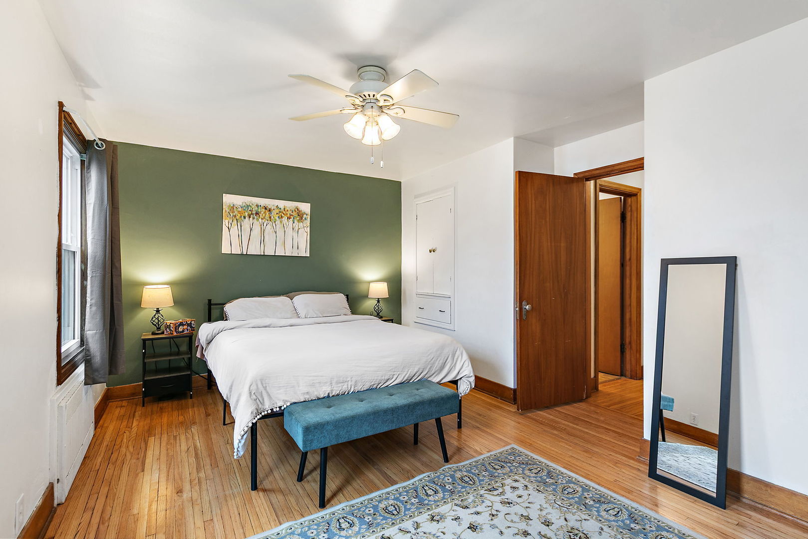 820 Lincoln Highway Rochelle, IL 61068 - Photo 11 of 27 a bedroom with a bed and a chandelier