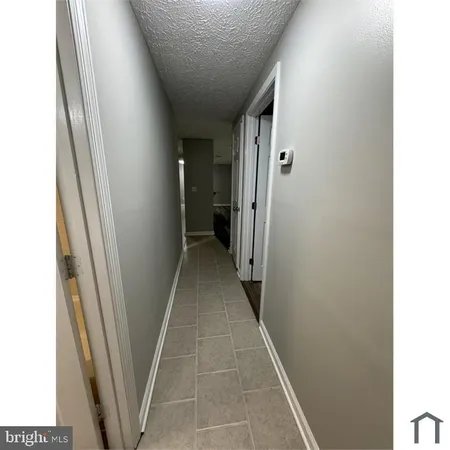 a view of hallway with windows