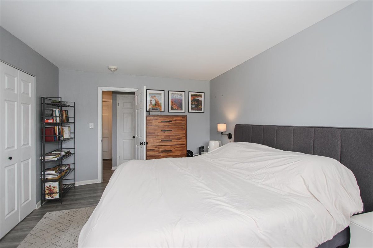 2300 Old Tavern Road, Unit 203 Lisle, IL 60532 - Photo 17 of 26 a bedroom with a bed and a closet