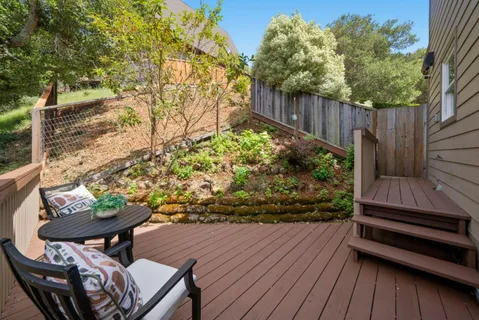 a view of a chairs and table in a patio