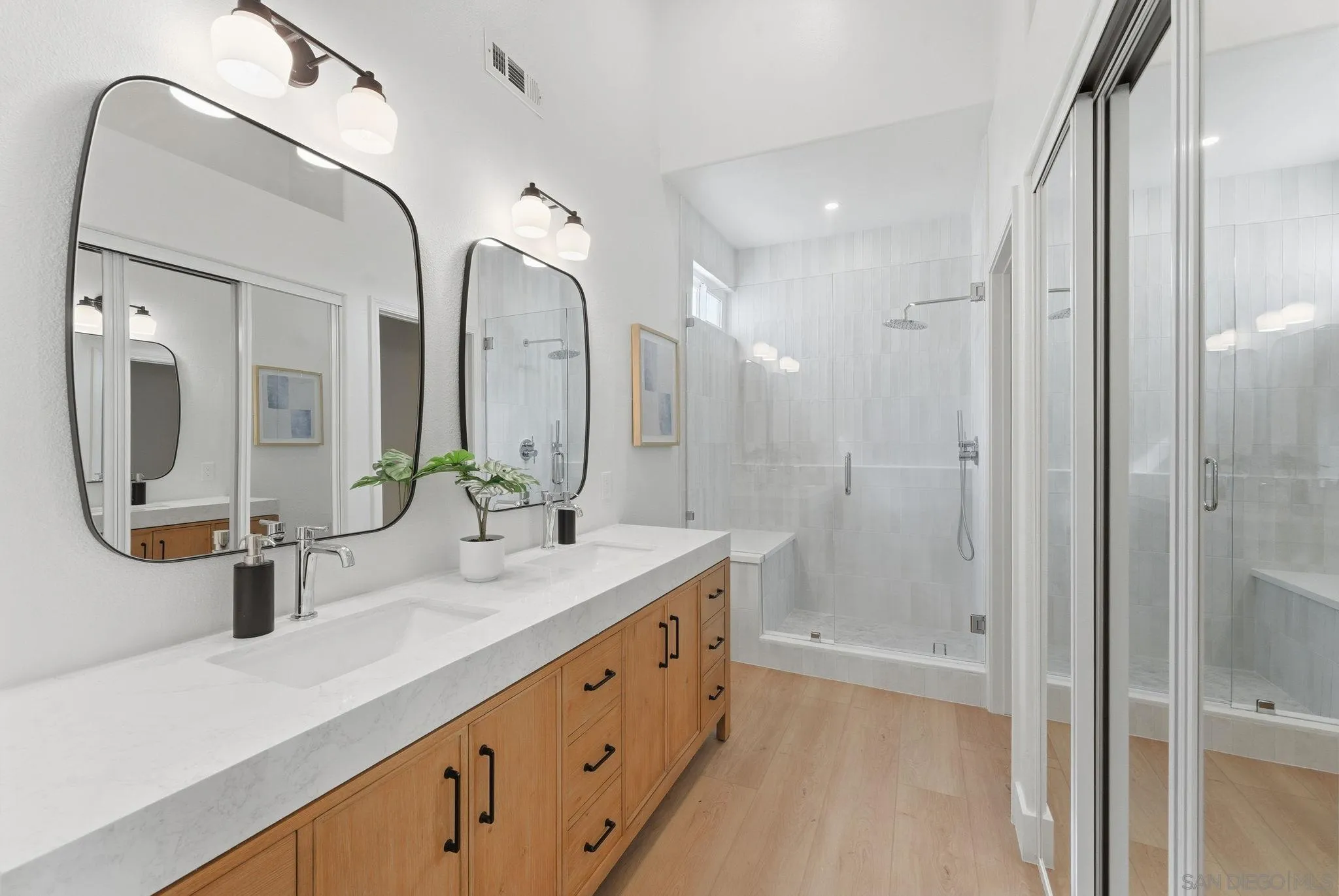 4744 Agora Way Oceanside, CA 92056 - Photo 23 of 31 a bathroom with a double vanity sink mirror and shower