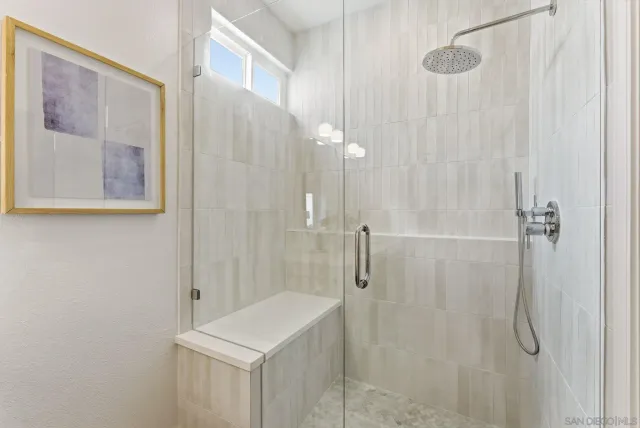 a bathroom with a shower curtain and a sink