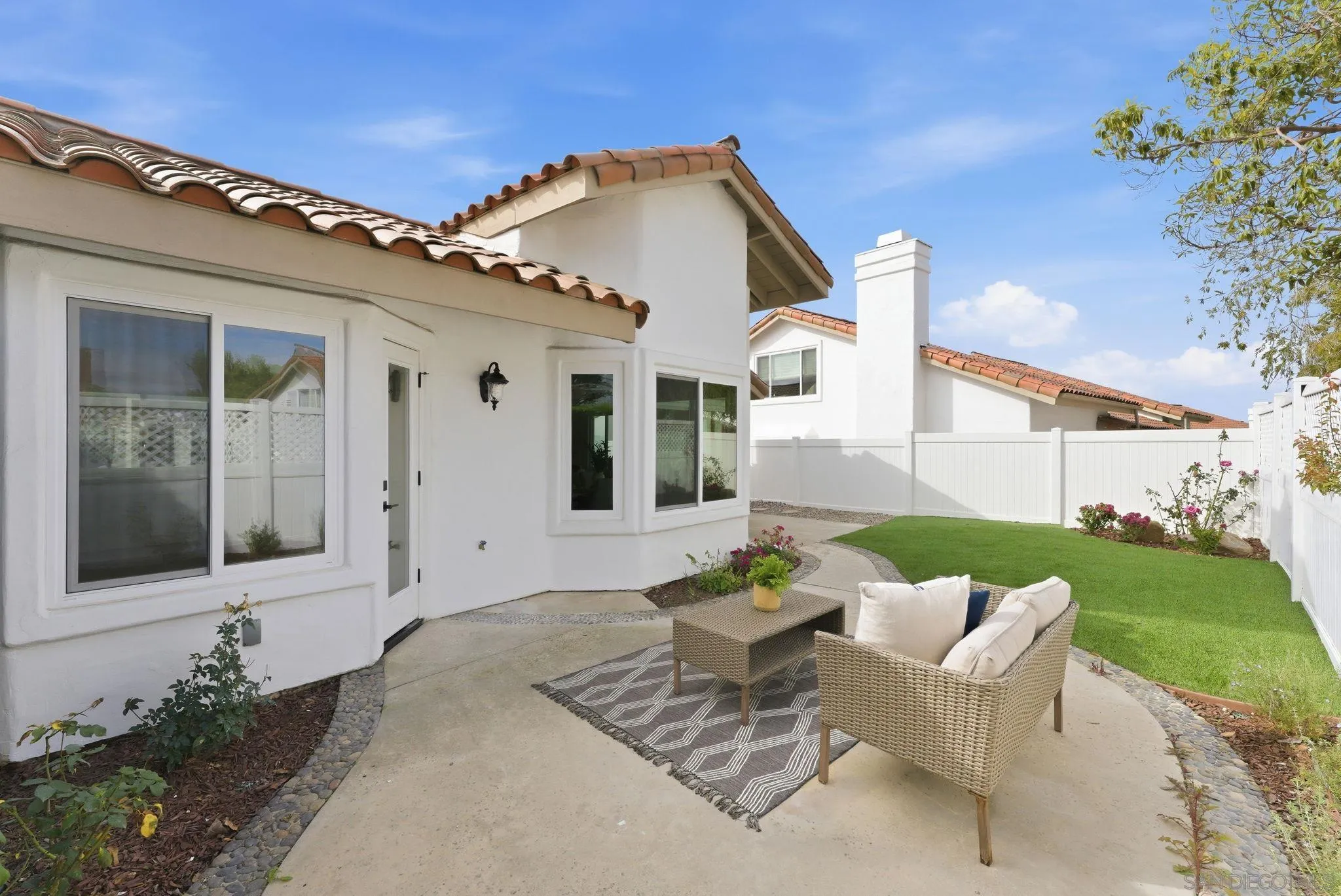 4744 Agora Way Oceanside, CA 92056 - Photo 29 of 31 a front view of a house with a garden and patio