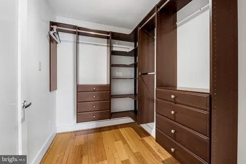 a room with a dresser and a mirror