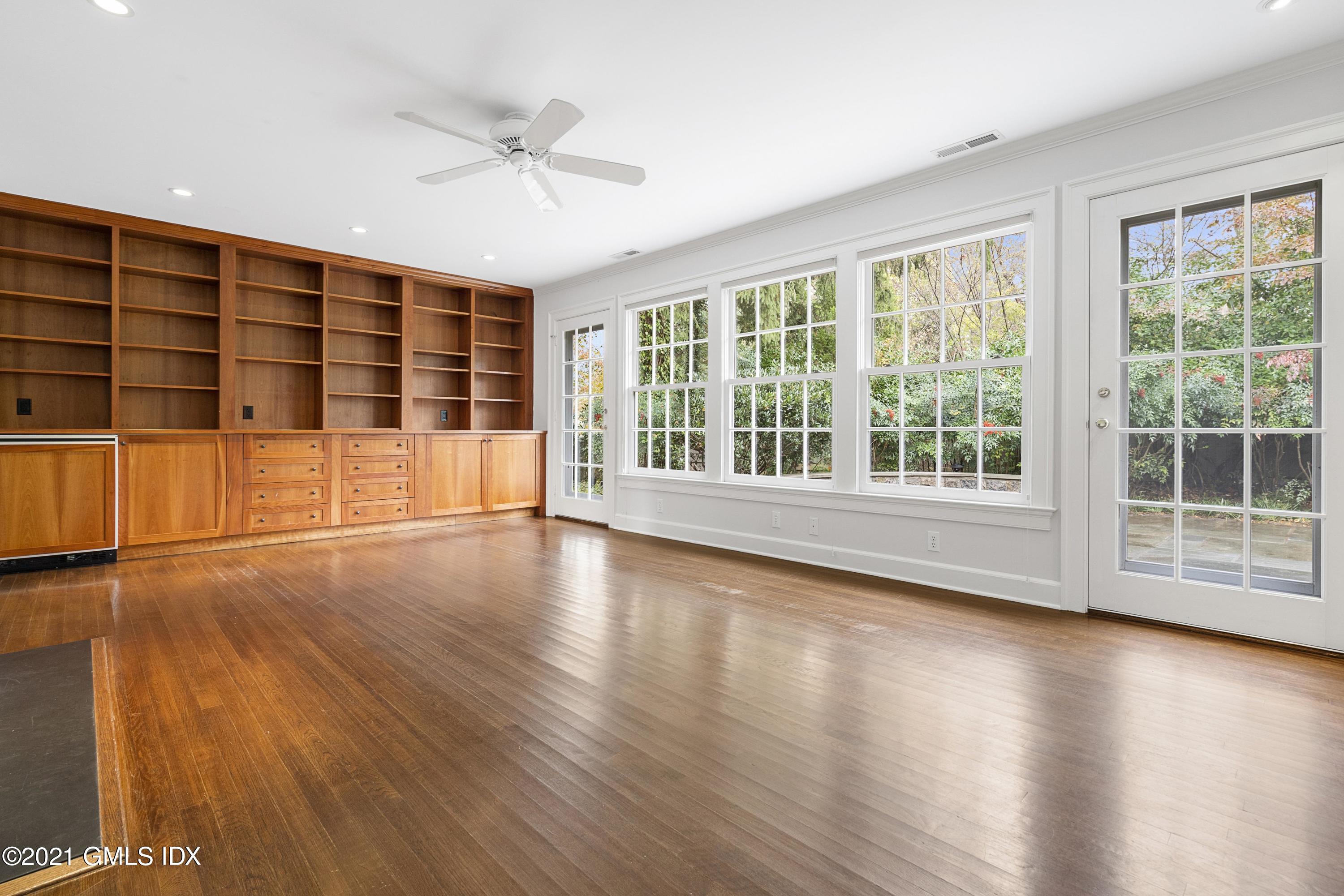 42 Indian Head Road Riverside, CT 06878 - Photo 4 of 47 a view of an empty room with wooden floor and a window