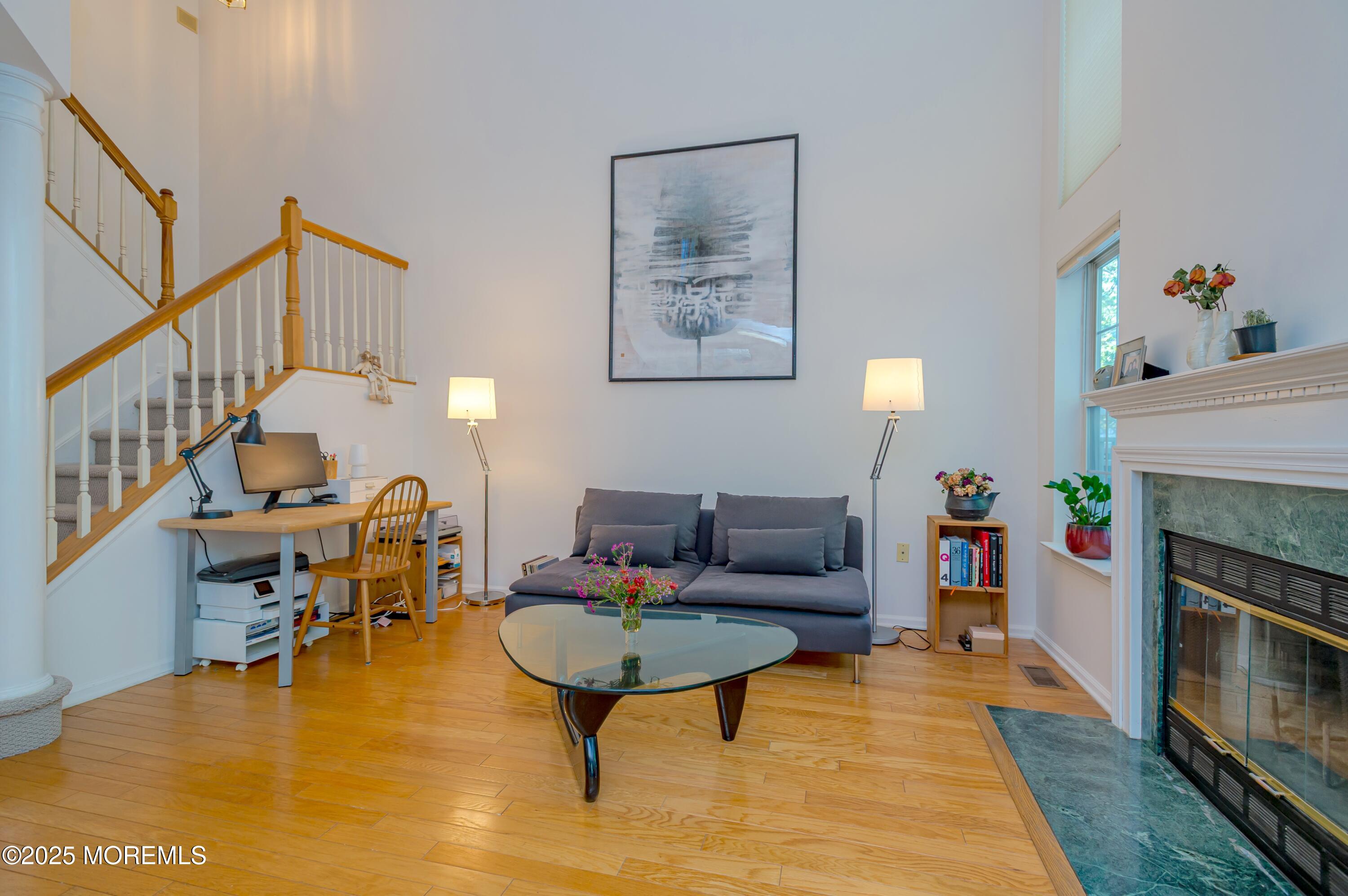 139 Tanya Circle, Unit 5506 Asbury Park, NJ 07712 - Photo 12 of 31 a living room with furniture and a fireplace