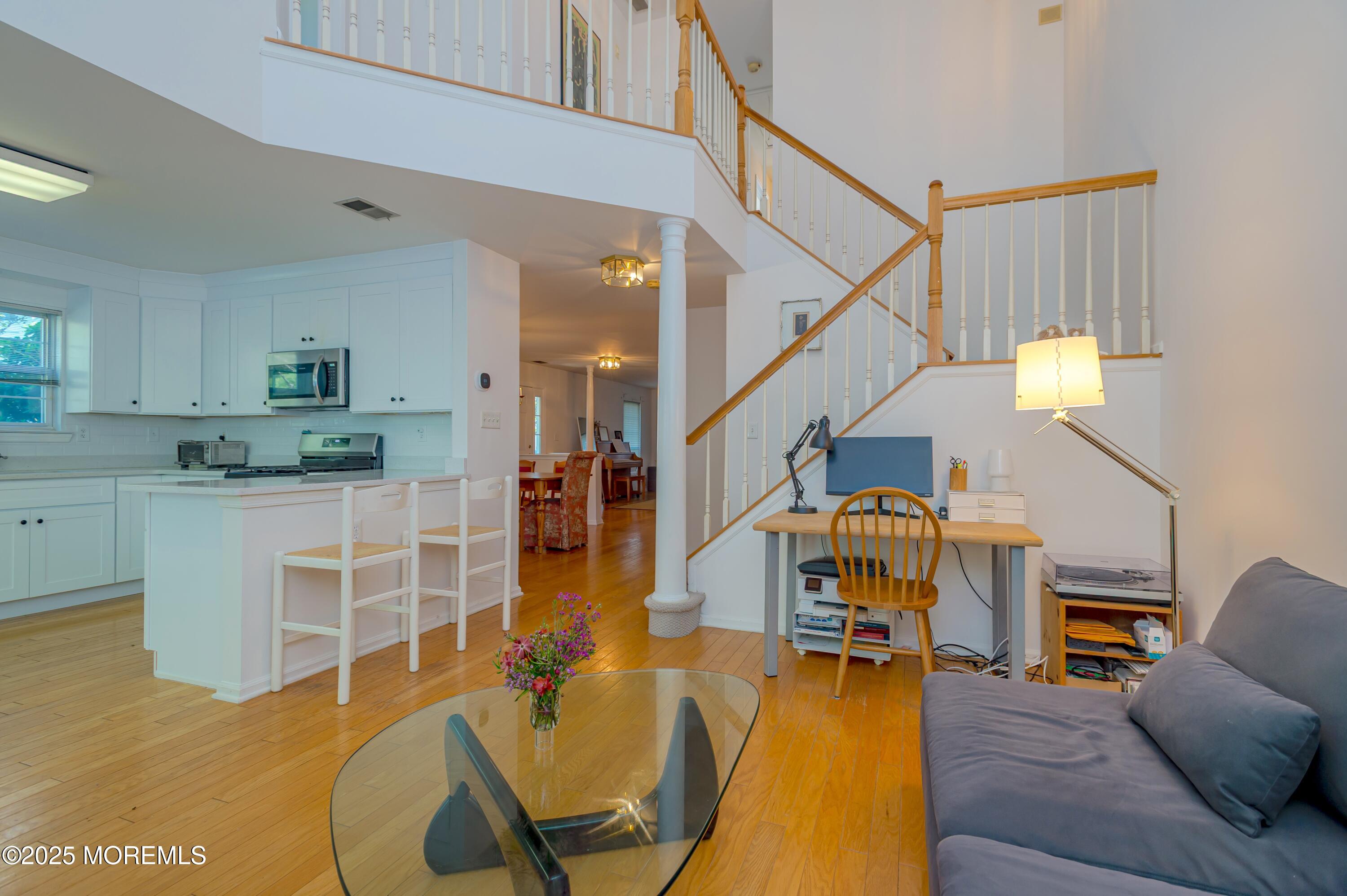 139 Tanya Circle, Unit 5506 Asbury Park, NJ 07712 - Photo 13 of 31 a living room with furniture and kitchen view