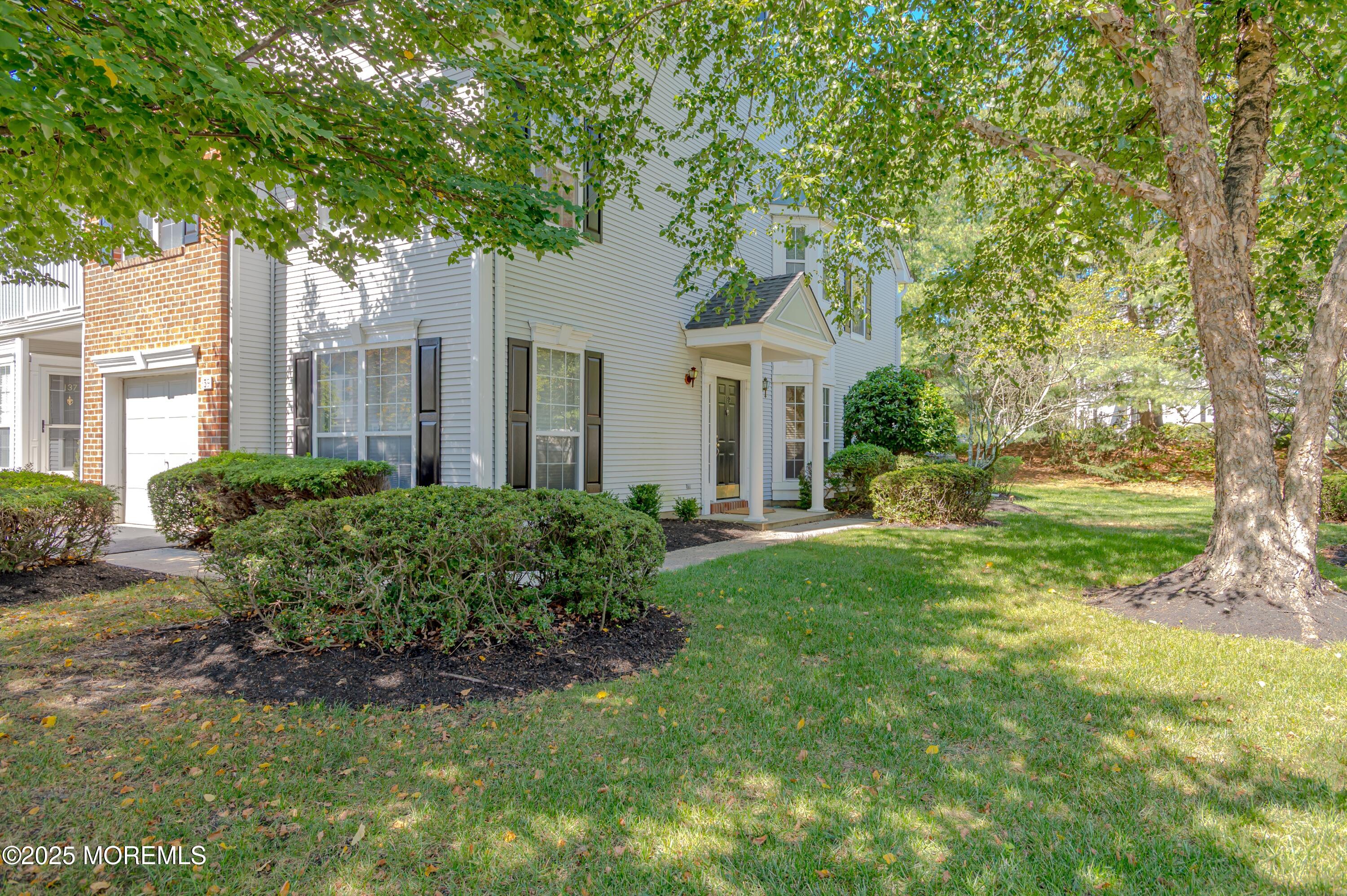 139 Tanya Circle, Unit 5506 Asbury Park, NJ 07712 - Photo 2 of 31 a front view of a house with garden