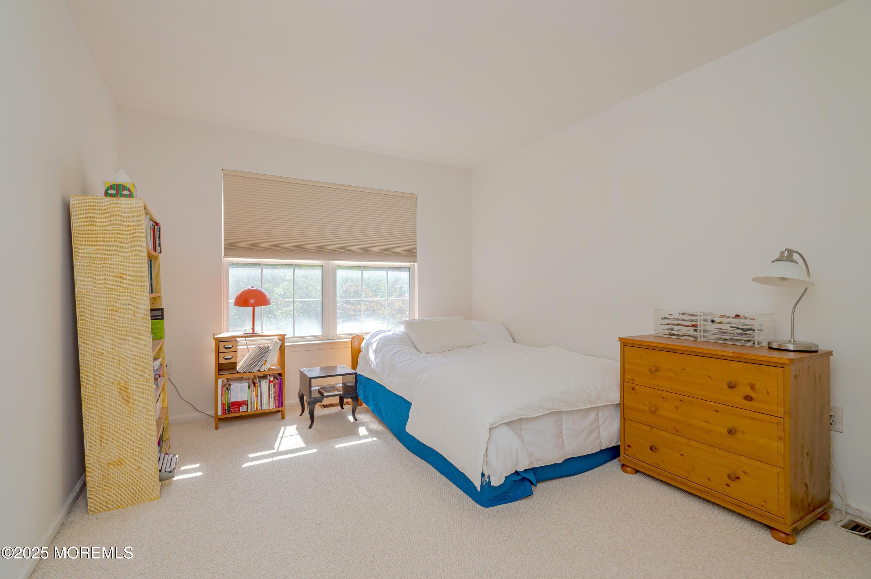 139 Tanya Circle, Unit 5506 Asbury Park, NJ 07712 - Photo 22 of 31 a bed room with a bed and a window