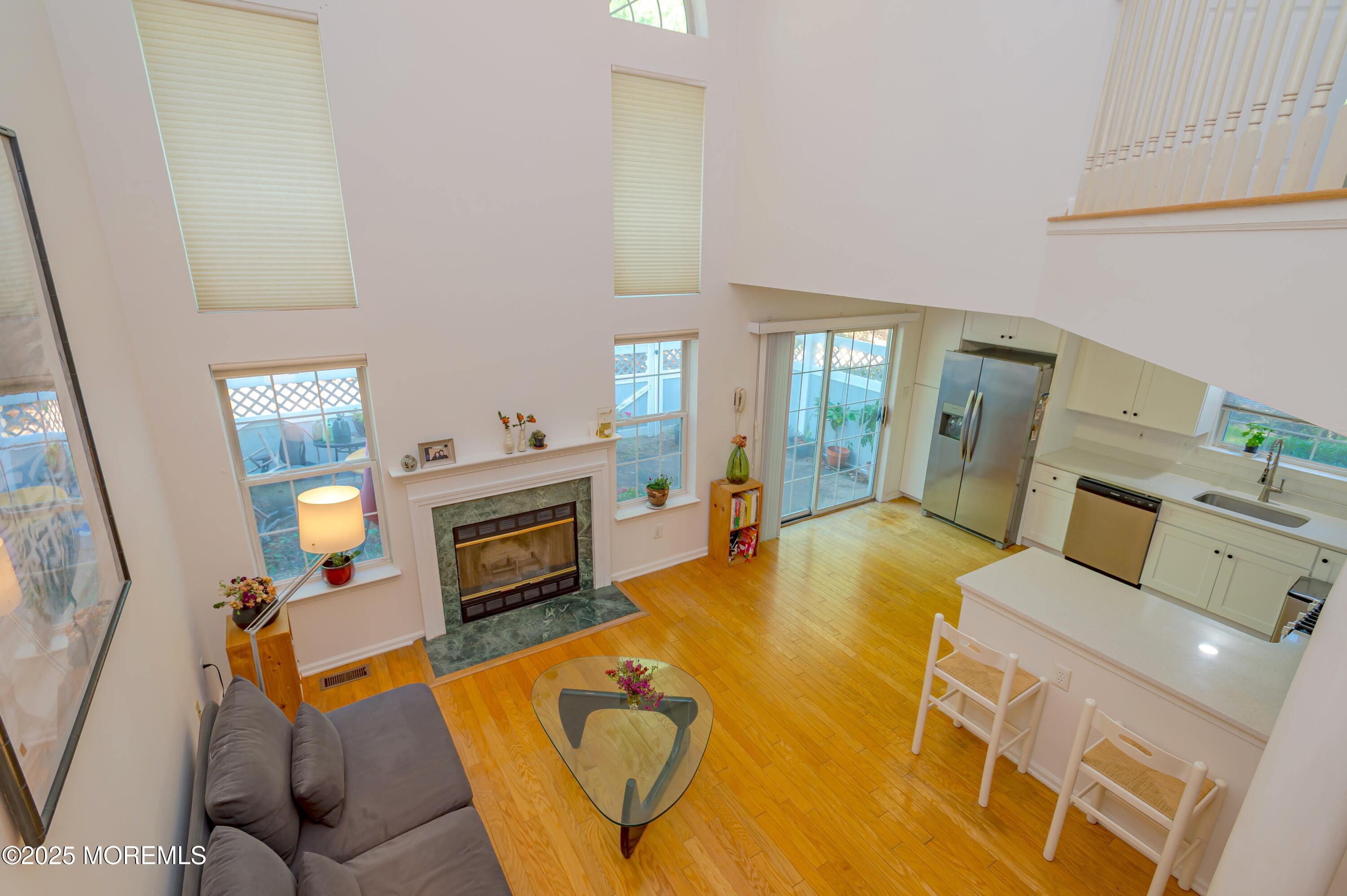 139 Tanya Circle, Unit 5506 Asbury Park, NJ 07712 - Photo 9 of 31 a living room with furniture and a fireplace