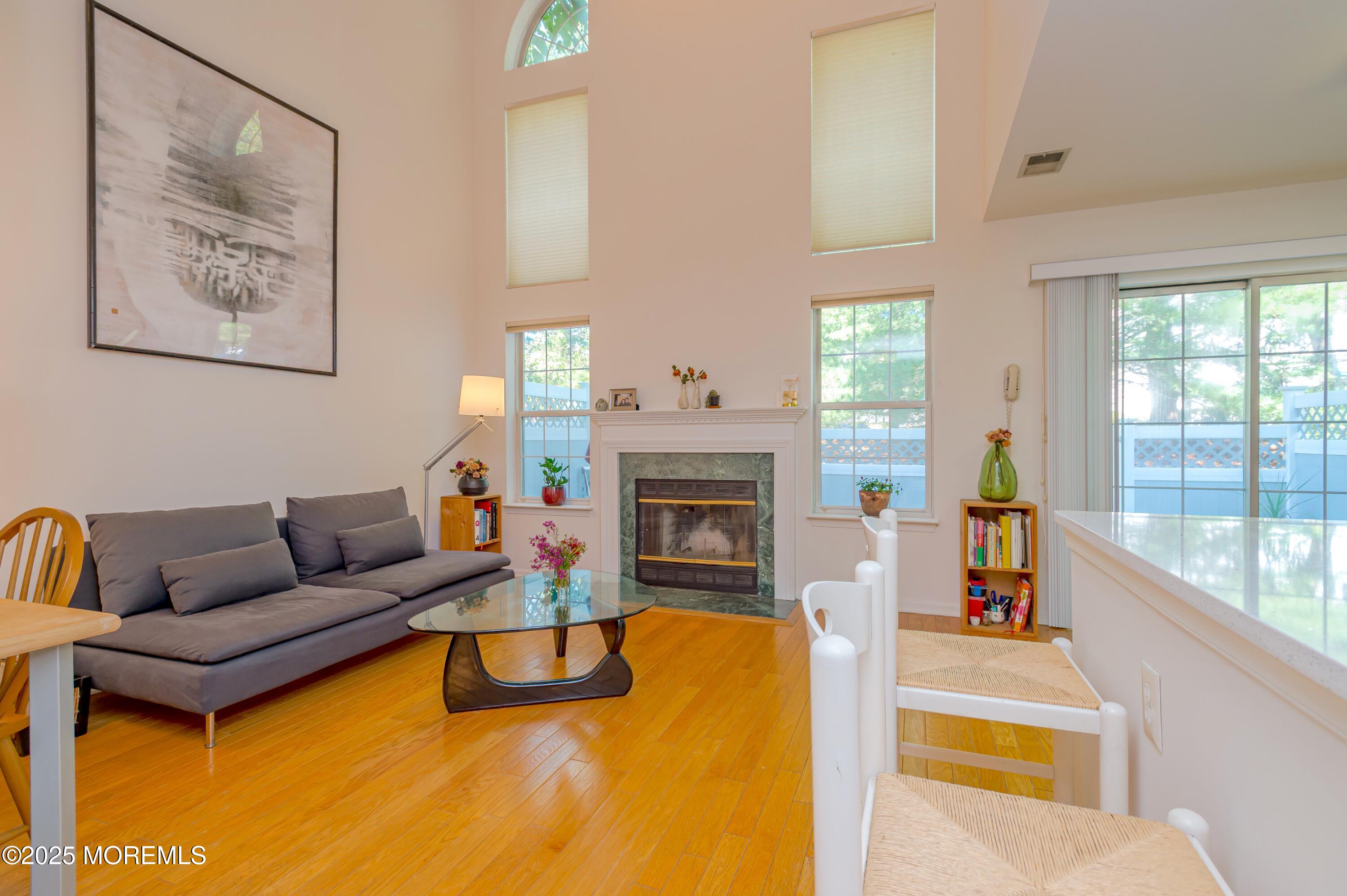 139 Tanya Circle, Unit 5506 Asbury Park, NJ 07712 - Photo 10 of 31 a living room with furniture and a fireplace