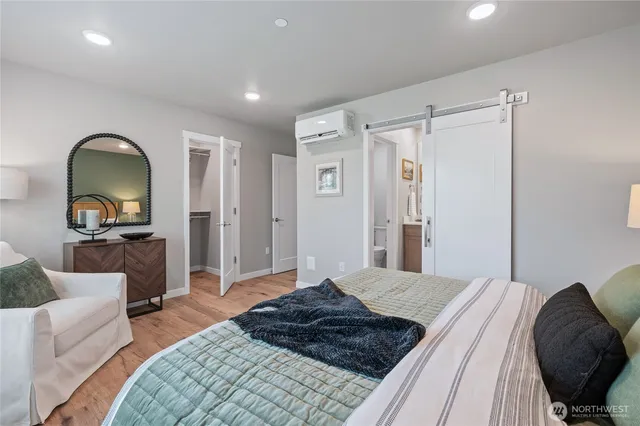 a bedroom with a bed and a dresser