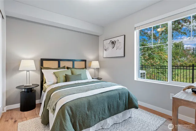 a bedroom with a bed and a window