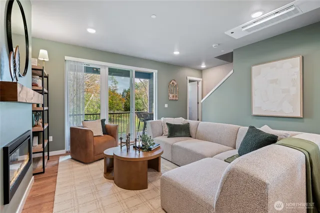 a living room with furniture and a large window