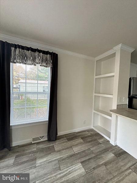 1679 South State Street, Unit A57 Dover, DE 19901 - Photo 16 of 25 a view of a kitchen with wooden floor and a window