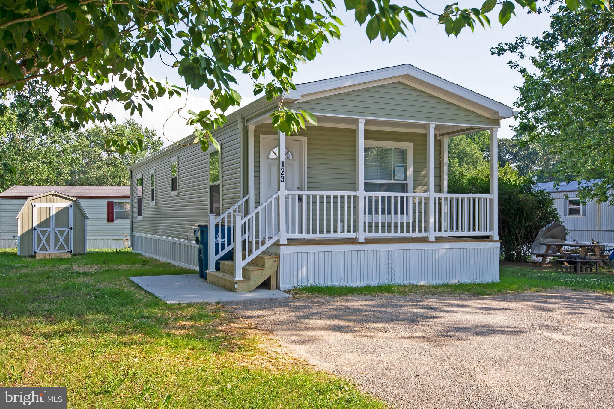 1679 South State Street, Unit A57 Dover, DE 19901 - Photo 3 of 25 a front view of a house with a yard