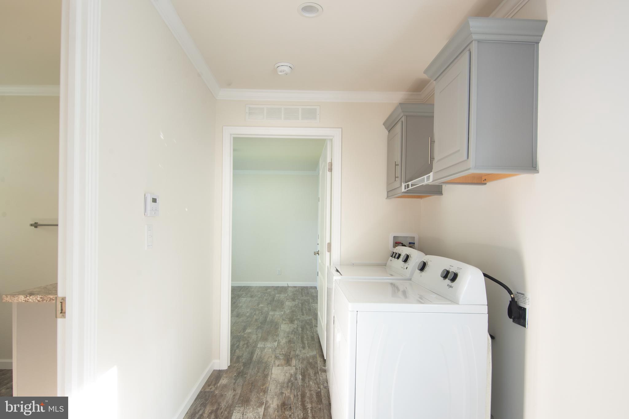 1679 South State Street, Unit A57 Dover, DE 19901 - Photo 9 of 25 a utility room with dryer and washer