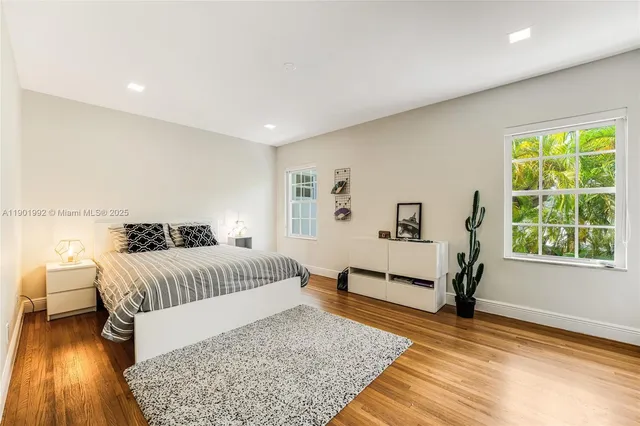 a living room with furniture rug and window