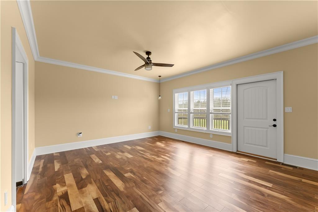 725 County Farm Road Jefferson, GA 30549 - Photo 24 of 66 a view of empty room with wooden floor and fan