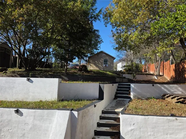 a view of a yard in front of a house