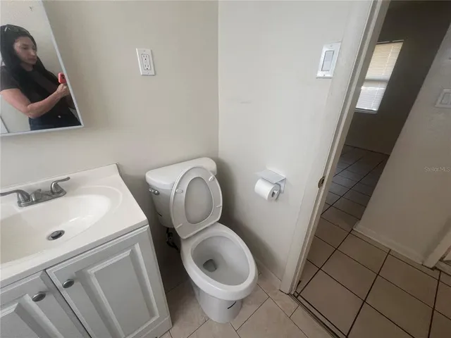 a bathroom with a toilet and a sink