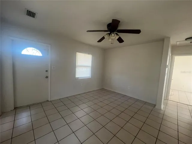 a view of an empty room and window