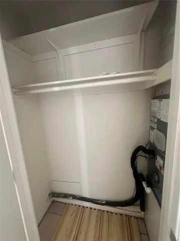 a view of a room with wooden floor and chair
