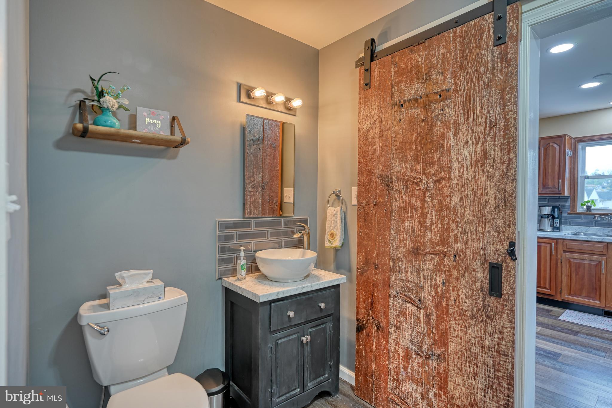 3320 Rothsville Road Akron, PA 17501 - Photo 16 of 41 a bathroom with a granite countertop sink toilet and shower