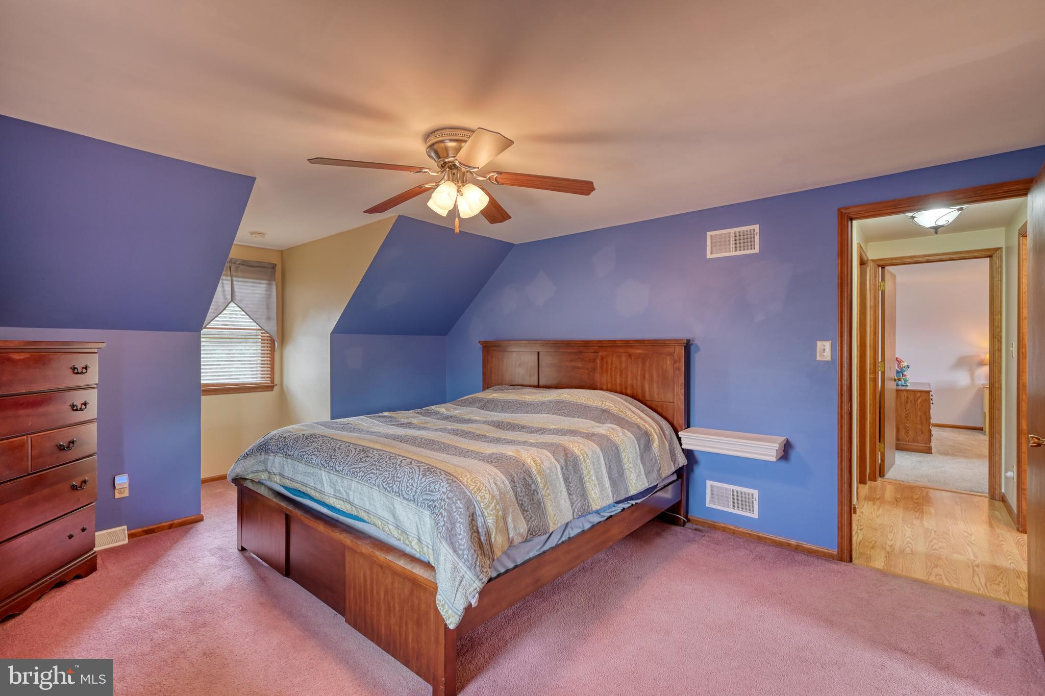 3320 Rothsville Road Akron, PA 17501 - Photo 18 of 41 a bedroom with a bed and a chandelier