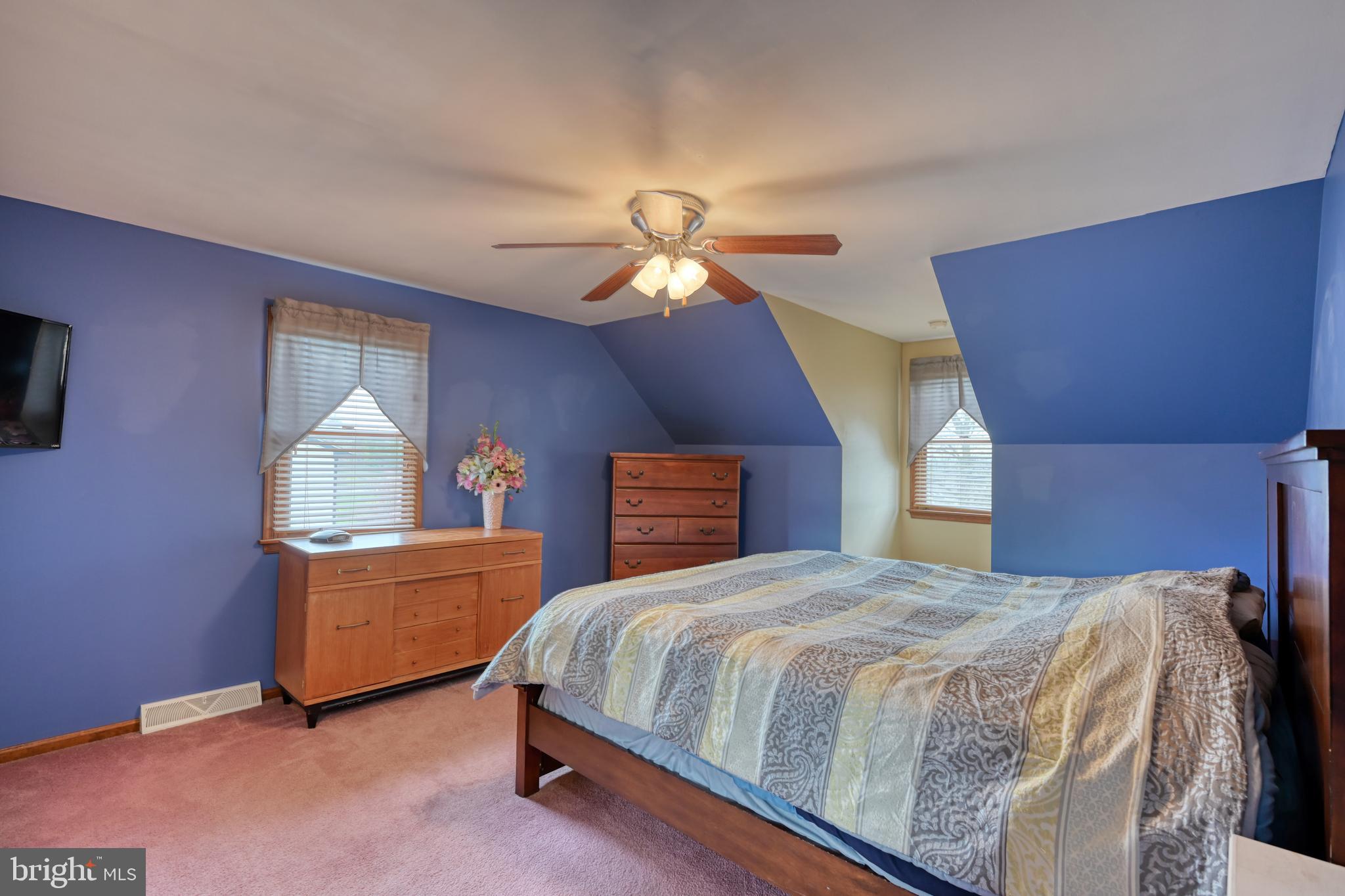3320 Rothsville Road Akron, PA 17501 - Photo 19 of 41 a bedroom with a bed and a chandelier