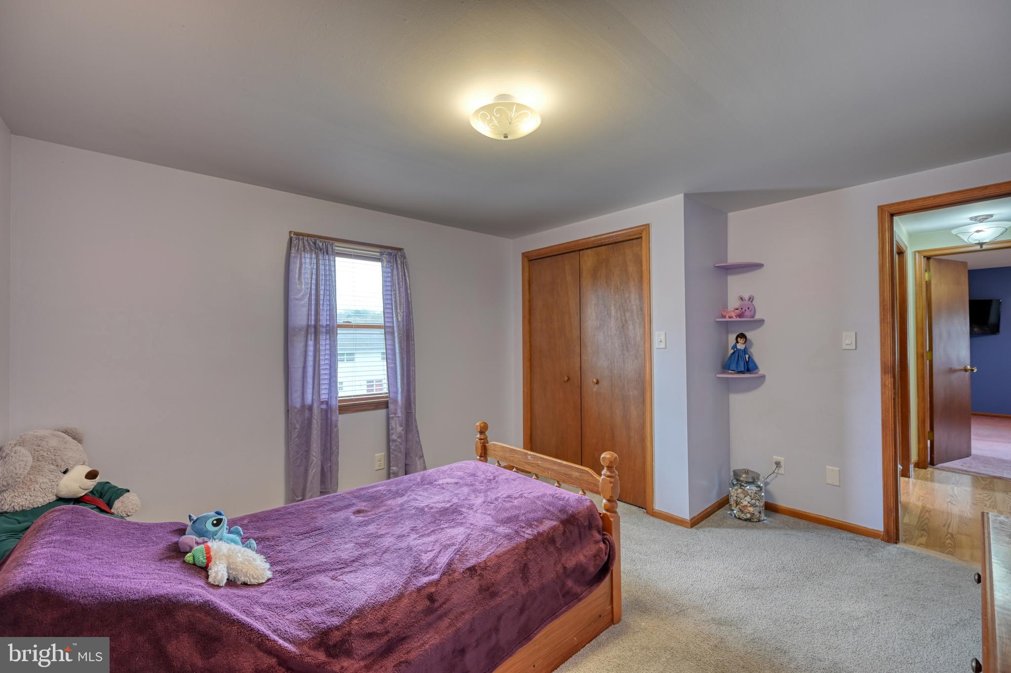 3320 Rothsville Road Akron, PA 17501 - Photo 26 of 41 a bedroom with a bed and a chandelier