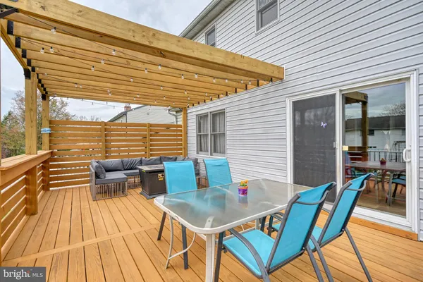 a balcony with table and chairs
