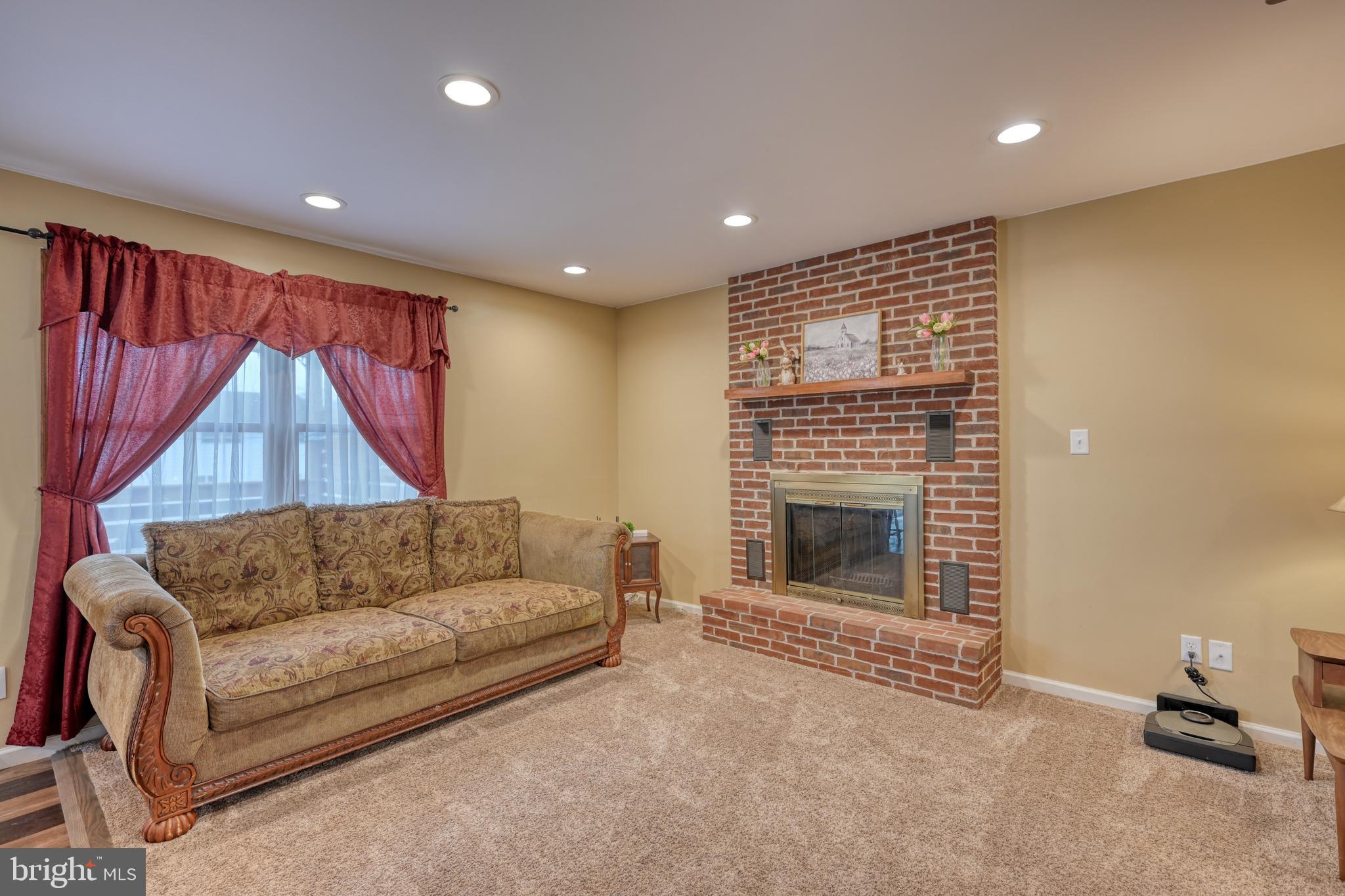 3320 Rothsville Road Akron, PA 17501 - Photo 7 of 41 a living room with furniture and a fireplace