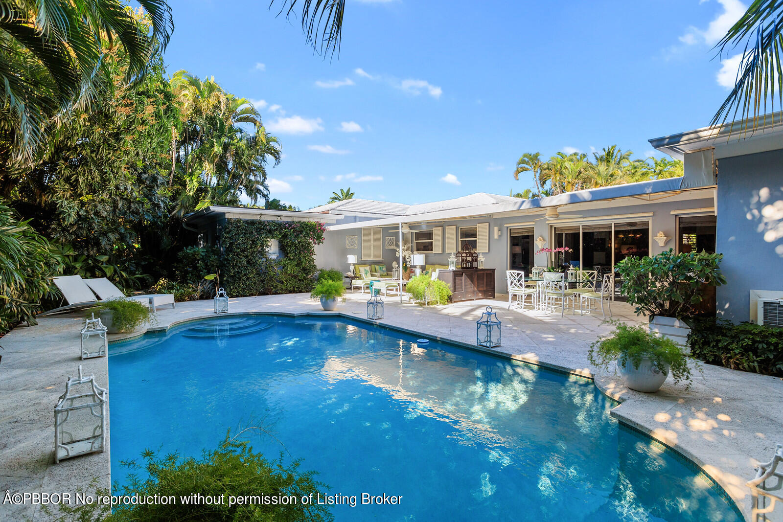 232 Mockingbird Trail Palm Beach, FL 33480 - Photo 2 of 14 a view of house with swimming pool outdoor seating