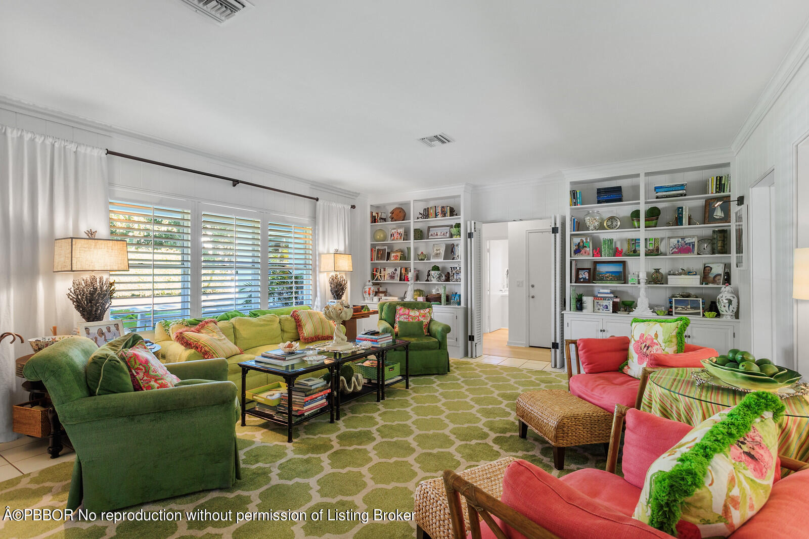 232 Mockingbird Trail Palm Beach, FL 33480 - Photo 3 of 14 a living room with furniture a rug and a large window