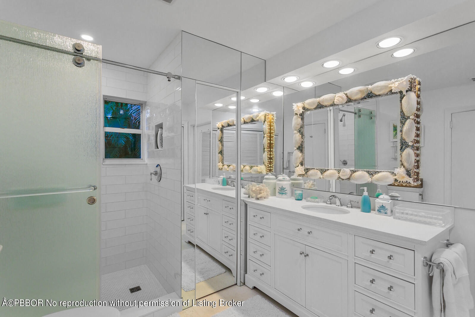 232 Mockingbird Trail Palm Beach, FL 33480 - Photo 9 of 14 a bathroom with a shower sink double and mirror