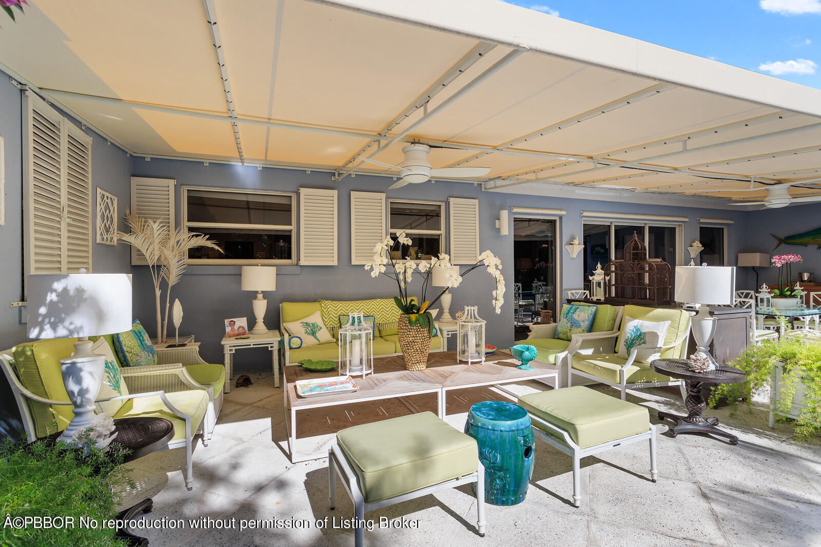 232 Mockingbird Trail Palm Beach, FL 33480 - Photo 10 of 14 a living room with furniture a flat screen tv and kitchen view