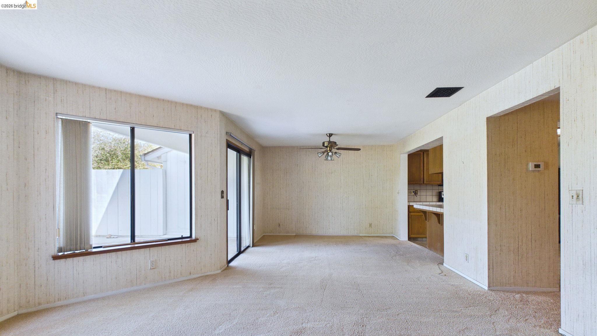 23686 Marble Quarry Road, Unit 72 Columbia, CA 95310 - Photo 17 of 35 Expansive room with neutral carpeting and textured wall coverings